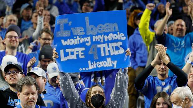 Detroit Lions fans celebrate after the Lions beat the L.A. Rams, 24-23, in the wild-card round of the NFL playoffs at Ford Field in Detroit on Sunday, Jan. 14, 2024.